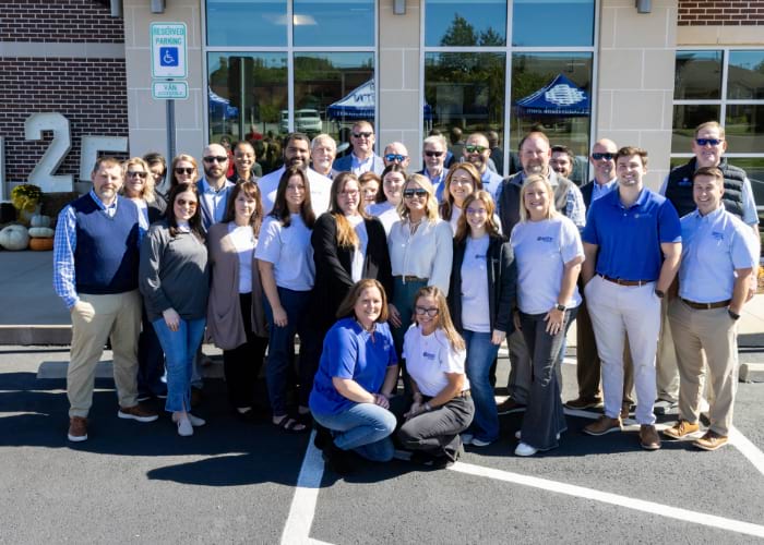 large group of people posing for the camera