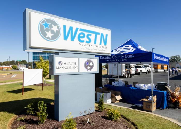 West Tennessee Bank sign with Decatur County Bank tent