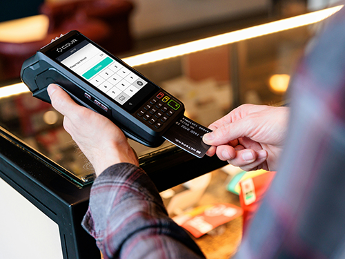 man using card reader to pay