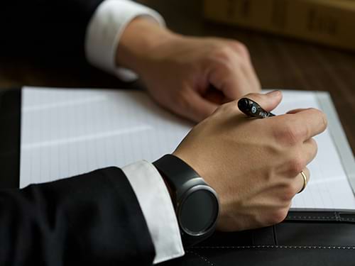 hands about to take notes on pad