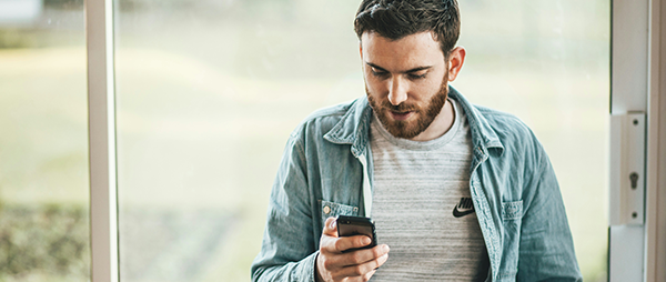 man looking at phone