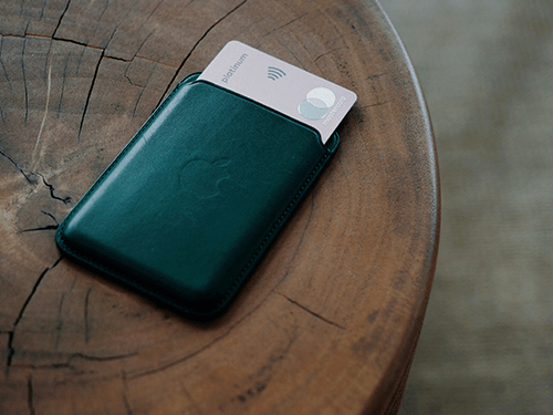 silver mastercard halfway put in green phone wallet
