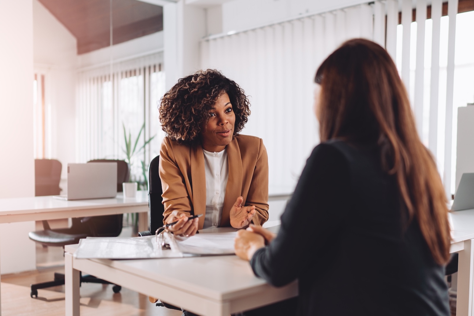 banker explaining options with woman