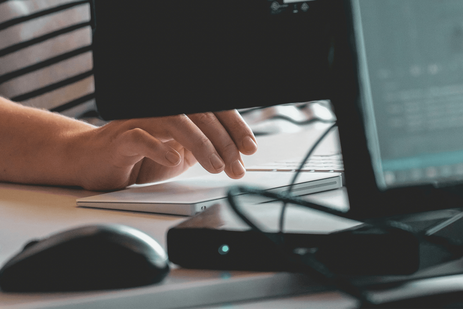 A person typing on a keyboard