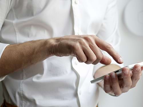 hands scrolling on phone