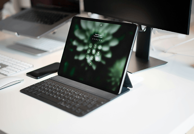 locked laptop on table with pinpad pulled up